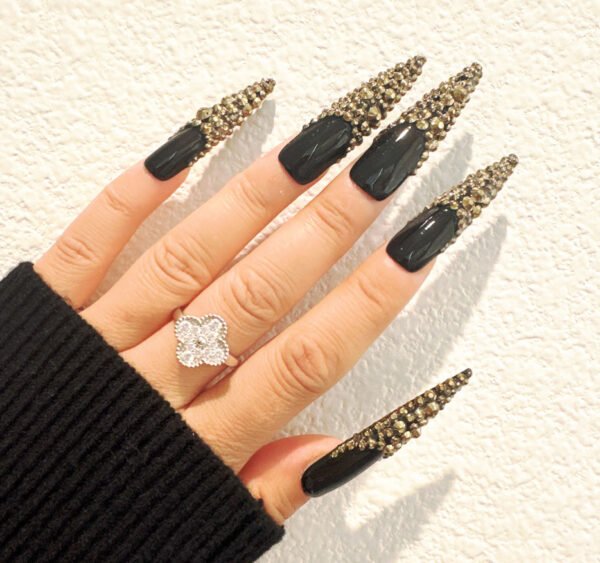 Black gold diamond jewelry with gradient long tapered nail polish design for manicure